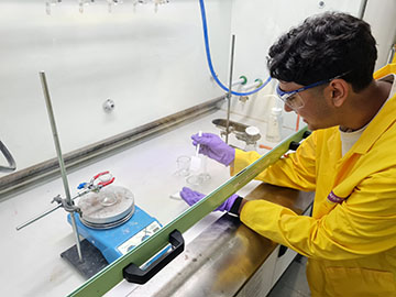 Photograph of students visiting a lab at Manchester University