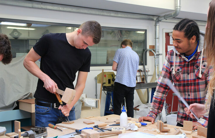 Photograph of students working on a 3D design project