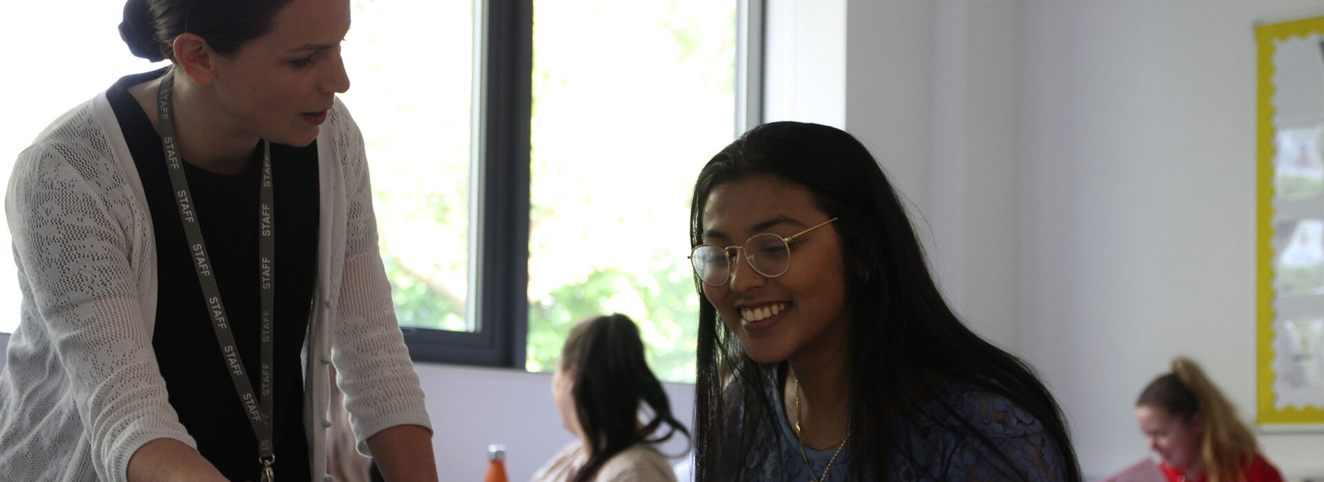 Photograph of Theology students in a classroom with a teacher