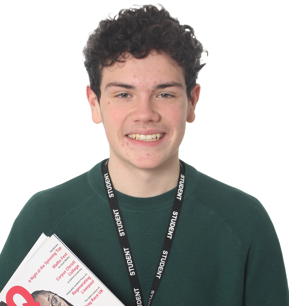 Photograph of a student holding a copy of the AQ Magazine