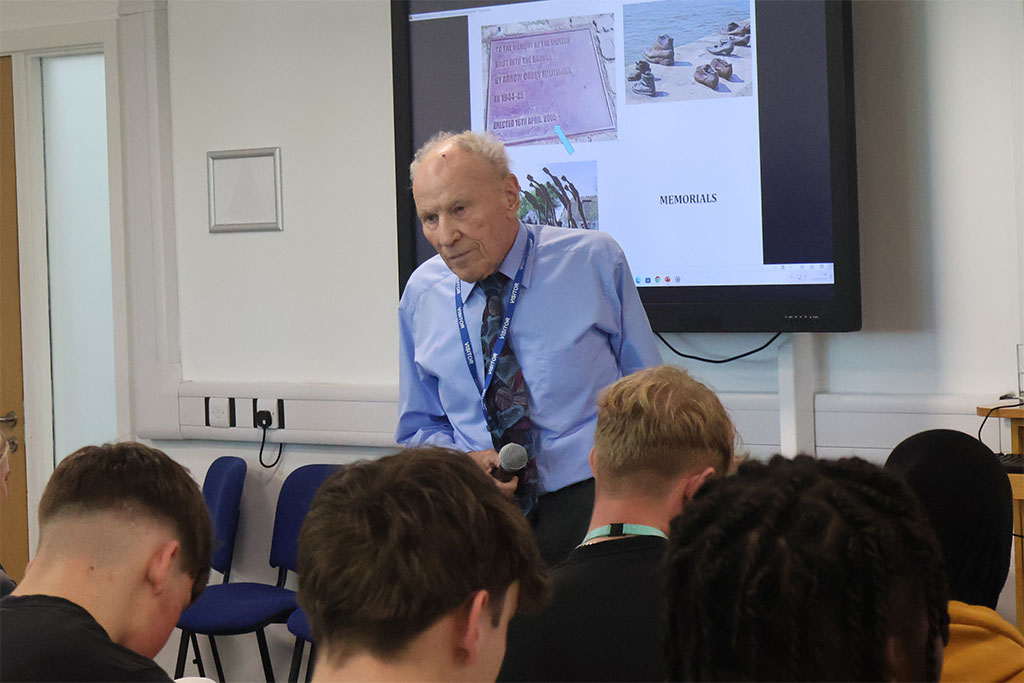 Photograph of a Holocaust survivor talking about his experiences