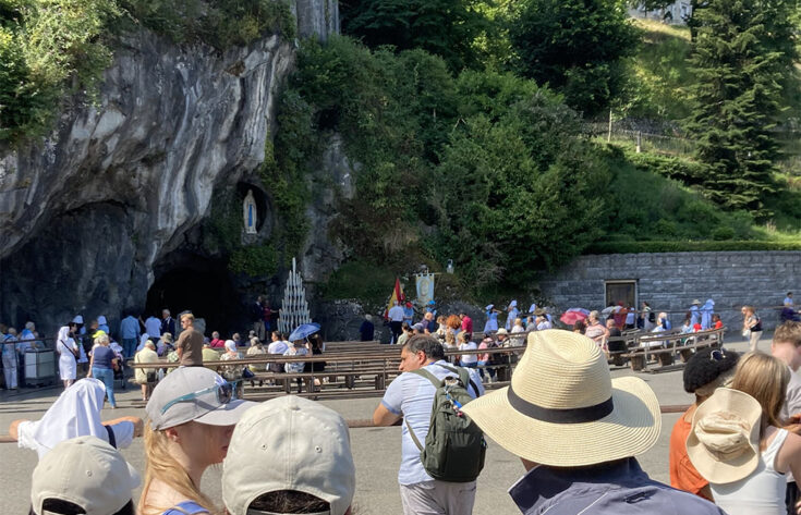 Photograph of students looking at the Grotto of the Apparition in Lourdes